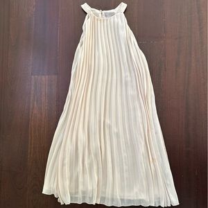 Flowy H&M cocktail dress. Cream colored . Gently used. Size Medium .